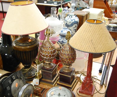 Lot 120 - A faux rouge marble table lamp, in the form of...