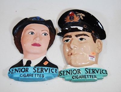 Lot 136 - A near pair of plaster advertising wall...