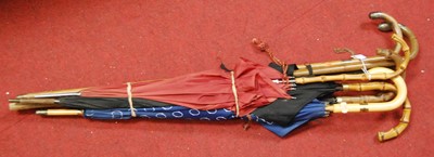 Lot 137 - A collection of various umbrellas, some with...