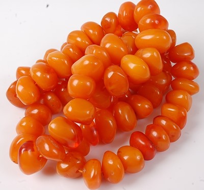 Lot 418 - A beaded faux amber necklace, 240g, length 90cm