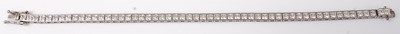 Lot 423 - A white metal and white stone set bracelet,...