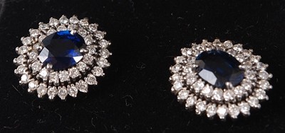 Lot 428 - A pair of white metal, blue and white sapphire...