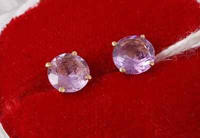 Lot 431 - A pair of yellow metal and amethyst set ear...