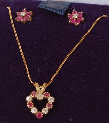 Lot 435 - A pair of yellow metal, ruby and diamond ear...
