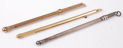 Lot 436 - An engine turned 9ct gold swizzle stick, 5.3g;...