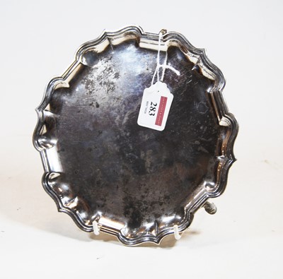 Lot 283 - An Edwardian silver card waiter, of shaped...