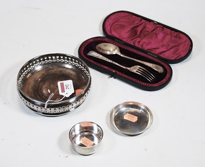Lot 292 - A modern silver bottle coaster, of squat...