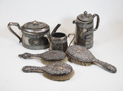 Lot 300 - Three various circa 1900 silver backed brushes;...