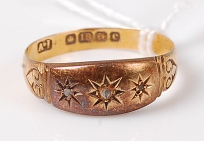 Lot 443 - An 18ct gold diamond three-stone ring, the...