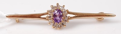 Lot 450 - A 9ct gold, amethyst and white stone set bar...