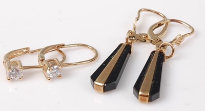 Lot 457 - A pair of yellow metal and black onyx set ear...