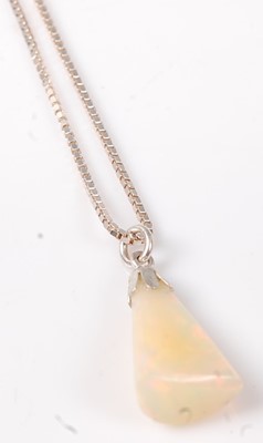 Lot 462 - A polished opal pendant, weighing approx 6.5...