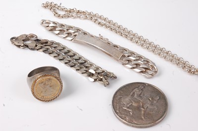 Lot 463 - A silver curblink identity bracelet; together...