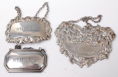 Lot 473 - Three modern silver decanter collars, two...