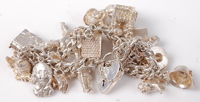 Lot 474 - A silver charm bracelet, 69g