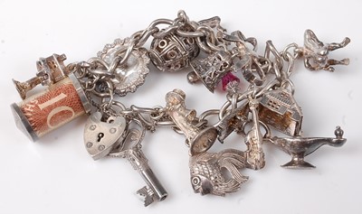 Lot 475 - A silver charm bracelet, 55g