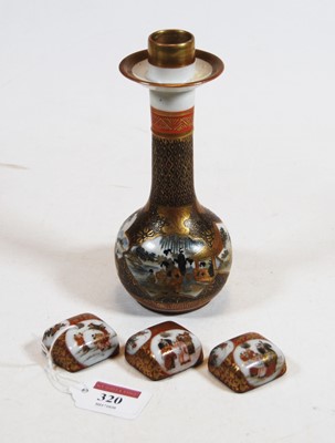 Lot 320 - A Japanese Meiji period kutani candlestick...