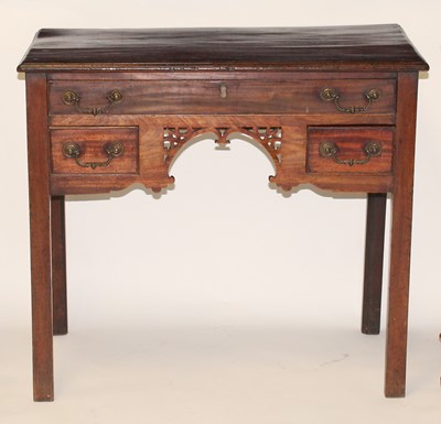 Lot 2498 - A George III mahogany lowboy, the top having a...