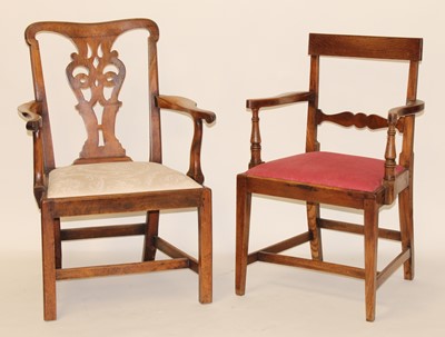 Lot 2472 - A George III fruitwood elbow chair, having...