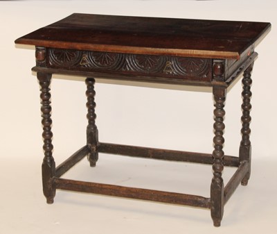 Lot 2473 - An antique joined oak side table, having a two-...