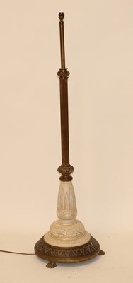 Lot 2476 - A late Victorian lacquered brass and stoneware...