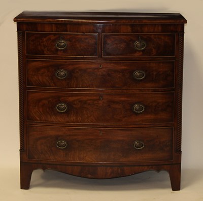Lot 2479 - A late Regency mahogany bowfront chest, having...