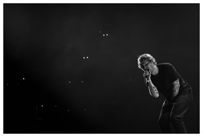 Lot 50 - A signed Ed Sheeran Photograph Ed Giving it...