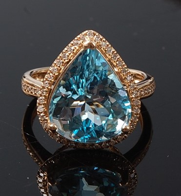 Lot 2202 - A yellow metal, topaz and diamond pear shaped...