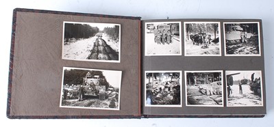 Lot 70 - A post WW II photograph album, the black and...