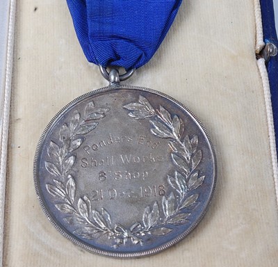 Lot 144 - A George V Munitions Factory silver medal the...