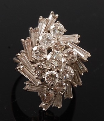 Lot 2227 - A white metal diamond cocktail ring, having...