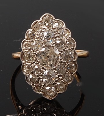 Lot 2224 - A yellow and white metal marquise shaped panel...