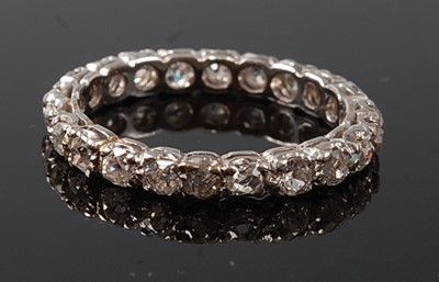 Lot 2237 - A white metal diamond full hoop eternity ring,...