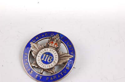 Lot 40 - A WW I silver War Badge, numbered verso 216977,...
