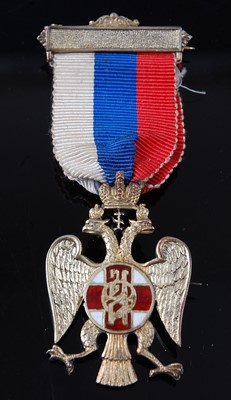 Lot 43 - An English made silver and enamelled badge for...