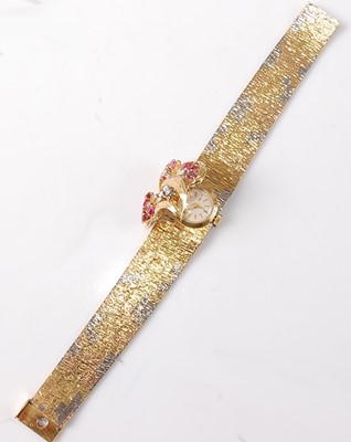Lot 2318 - A ladies 18ct three-colour gold, ruby and...