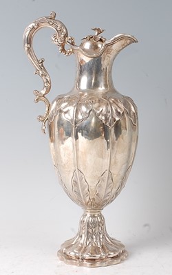 Lot 2134 - A Victorian silver claret jug, the lobed body...
