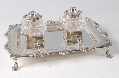 Lot 2139 - An Edwardian silver desk stand, of shaped...