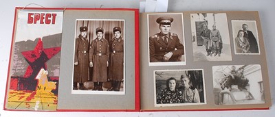 Lot 173 - An album of photographs the contents to...
