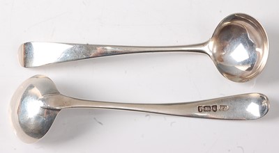 Lot 2183 - A pair of George III silver sauce ladles, in...