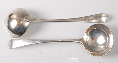 Lot 2194 - A pair of George III silver sauce ladles, in...