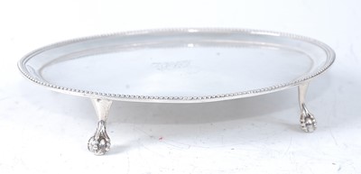 Lot 2178 - A George III silver teapot stand. of beaded...