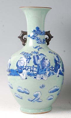 Lot 2372 - A Chinese export celadon ground baluster vase,...