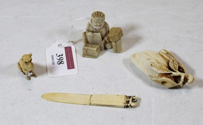 Lot 398 - A Japanese Meiji period ivory okimono carved...