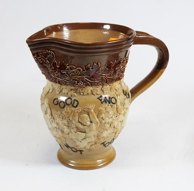 Lot 65 - A Doulton Lambeth stoneware jug, with bucolic...