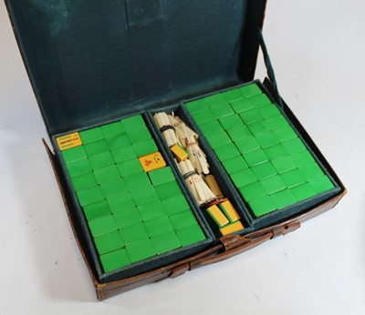 Lot 92 - A 20th century plastic mah jong set, housed in...