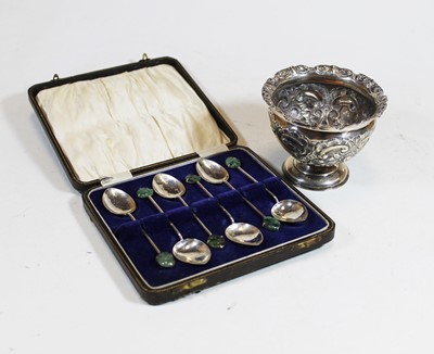 Lot 333 - A silver cup, the flared rim above a repoussee...