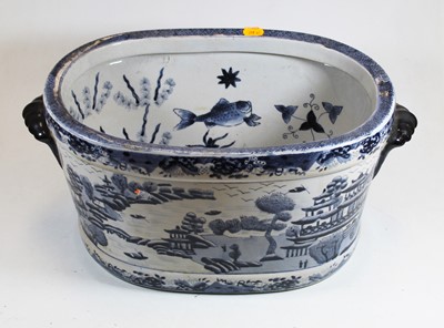Lot 177 - A blue and white stoneware footbath, decorated...
