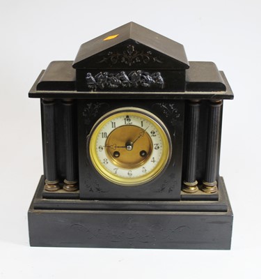 Lot 105 - A Victorian black slate mantel clock of...