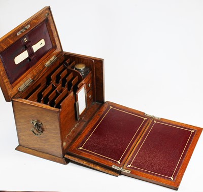 Lot 112 - An early 20th century oak stationery box, the...